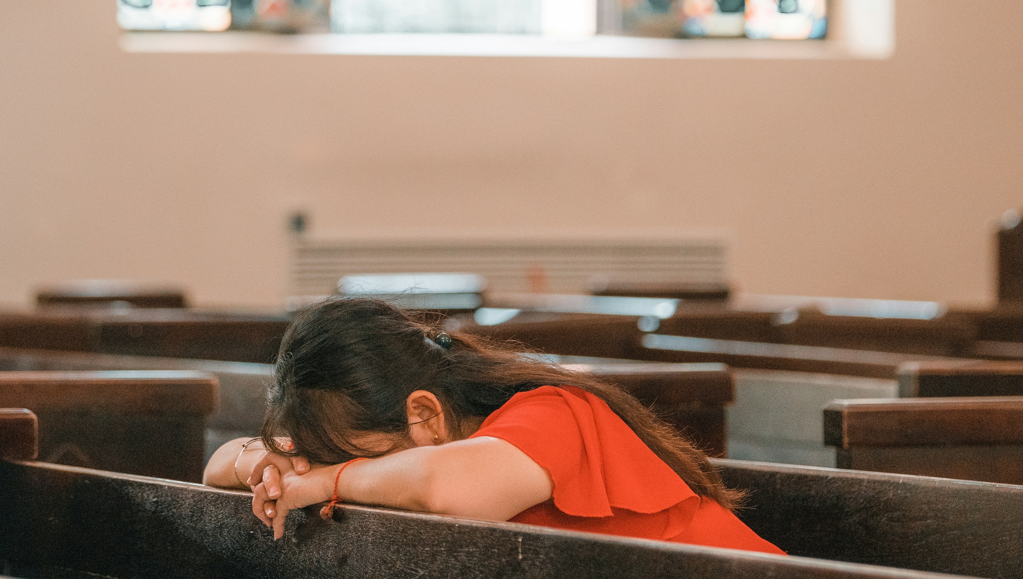 Woman in pew photo